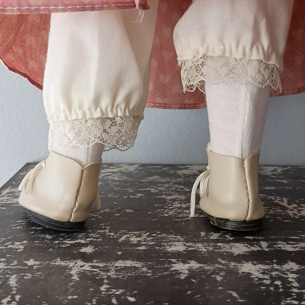 Vintage Porcelain Doll with Pink Dress and Bonnet by Dynasty Dolls